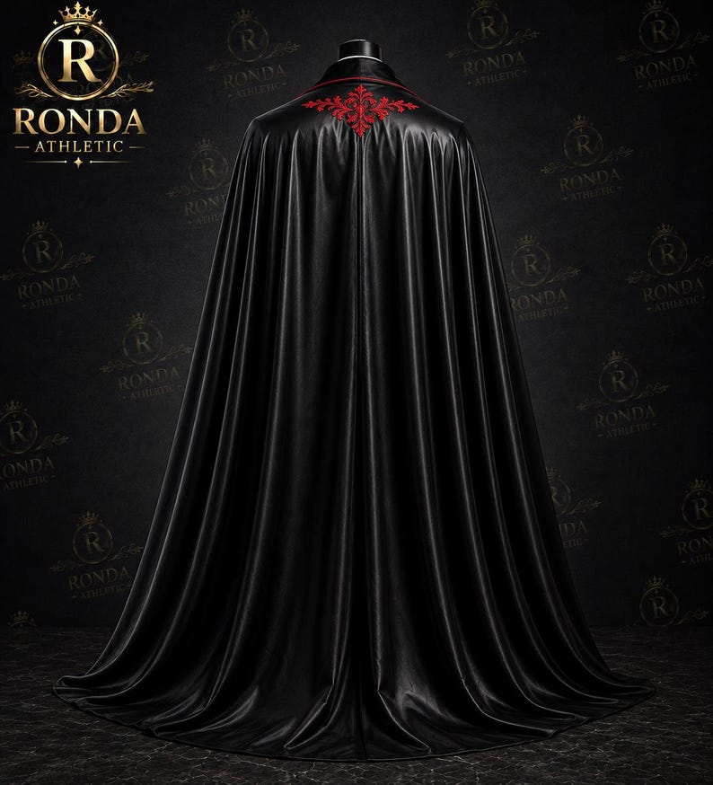 Luxury black velvet Dracula cape with red satin lining and embroidered Victorian suit for masquerade, steampunk events, and gothic fashion.