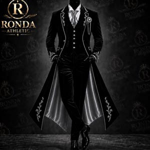 May include: A black velvet tailcoat suit featuring a white shirt, a vest with silver buttons, and matching trousers. The coat has white piping, floral embroidery on the lapels and cuffs, and a silver chain accessory. The brand Ronda Athletic is visible.
