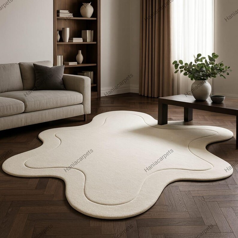 Transform your space with this Solid Off White Irregular Amoeba Shape Rug, a modern hand-tufted wool area rug designed to bring style, comfort, and uniqueness to your home. Crafted with a soft high pile texture, this rug creates a cozy and inviting feel underfoot, making it perfect for living rooms, bedrooms, nurseries, or kids’ play areas. Its off-white tone blends seamlessly with any interior style, from minimalist and Scandinavian to boho and contemporary décor.