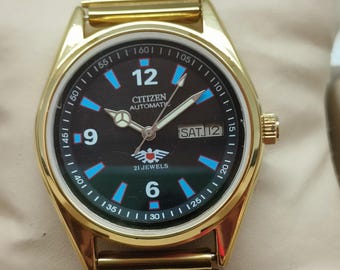 Reloj de pulsera Citizen automático para hombre, esfera negra, día y fecha, 21 joyas, chapado en oro