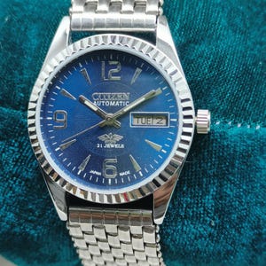 Reloj de pulsera Citizen automático de acero inoxidable para hombre, esfera azul, 21 joyas, día y fecha.
