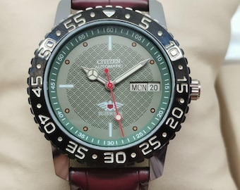 Reloj de pulsera Citizen automático deportivo con esfera verde, día y fecha, 21 joyas, acero inoxidable para hombre