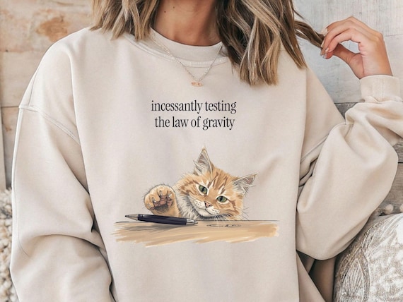 Funny Cat Sweatshirt for Cat Lover Gift Unisex Pullover of playful cat testing gravity for Birthdays Humorous Cat Gift for christmas