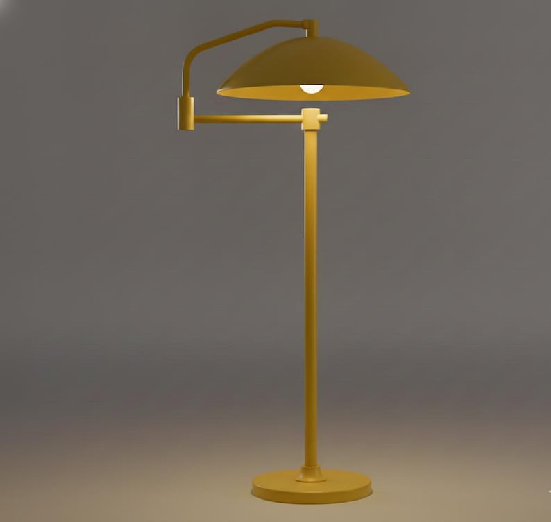May include: A yellow floor lamp with a domed shade and adjustable arm. The lamp has a round base and a straight pole. The light bulb is visible inside the shade. The lamp is made of metal and has a matte finish.