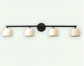 May include: A black, four-light vanity light fitting. The fitting has a horizontal bar with four off-white, dome-shaped shades. The shades are evenly spaced and attached to the bar. A circular plate is in the centre of the bar.