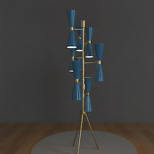 May include: A modern floor lamp with a brass tripod base and multiple blue cone-shaped shades. The lamp has a mid-century modern design, with a series of lights branching out from a central pole. The lamp is approximately 60 inches tall.