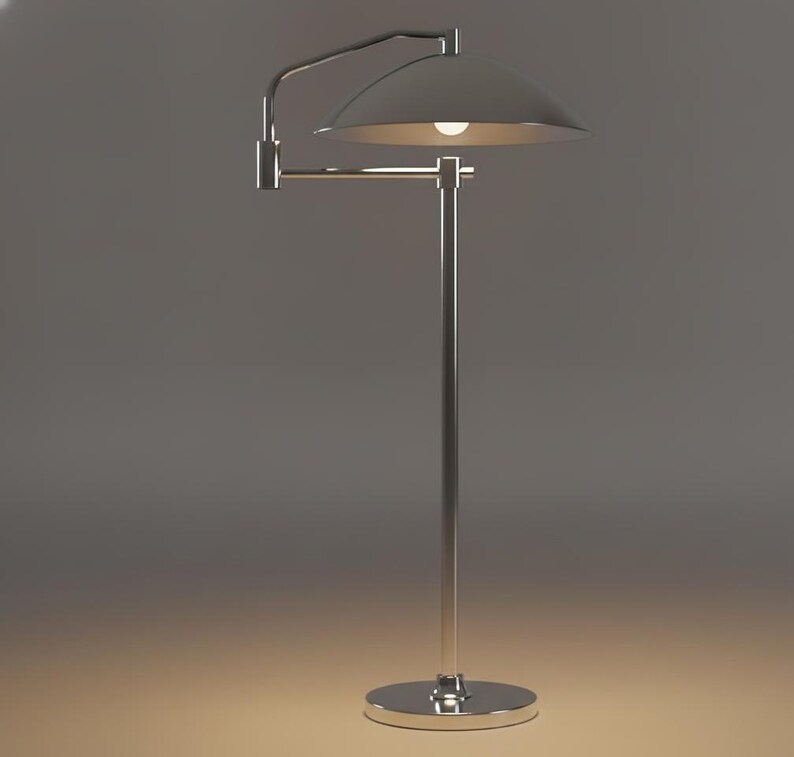 May include: A contemporary floor lamp in silver with a curved arm and a domed lampshade. The lamp features a circular base and a single light bulb. The design is sleek and minimalist, suitable for modern interiors.