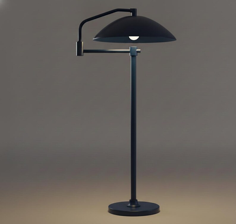 May include: A contemporary black floor lamp featuring a curved arm and a domed shade. The lamp has a circular base and a slender pole. The light is on, illuminating the area below. A stylish addition to any room, it is a modern lighting solution.