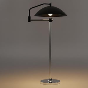 May include: A contemporary floor lamp featuring a black, dome-shaped lampshade and a chrome-plated pole and base. The lamp has an adjustable arm and a single light bulb. The design is minimalist and suitable for various interior styles.