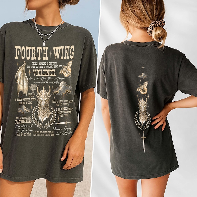 May include: A charcoal gray t-shirt featuring a graphic print of a dragon, wings, and a sword. The front displays the text "FOURTH WING" and "VIOLENCE" with additional quotes. The back features a vertical design of a dragon head, sword, and clouds.
