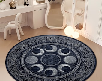 May include: A round, dark blue rug featuring a celestial design with phases of the moon. The rug has an ornate border and is placed on a light-colored floor. The rug's diameter is approximately 60 inches.