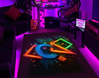 May include: Black rectangular rug with a neon-style design featuring a blue circle, orange triangle, and green square. The rug has a gaming theme with a dark background and colorful accents.