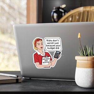 May include: A sticker featuring a retro-style illustration of a woman in a red uniform holding a calculator and a clipboard labeled "UNFUNDED RISK REGISTER." A speech bubble says, "Risks don't vanish just because your budget did."