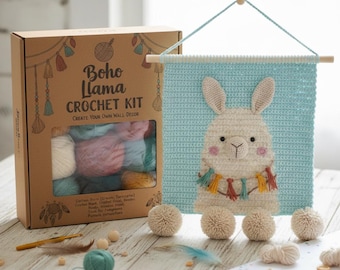 May include: A Boho Llama Crochet Kit with a light blue wall hanging featuring a llama design. The kit includes yarn in various colors, a crochet hook, and wooden beads. The wall hanging is approximately 12 inches wide.