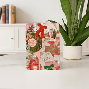 May include: A rectangular decorative tray featuring a Christmas collage design. The design includes a red mailbox, envelopes, a Christmas tree, and a bicycle. A large red bow is tied at the top. The text on the tray reads "Rocking around Christmas tree."