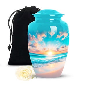 Turquoise beach cremation urn with sunrise over ocean waves
