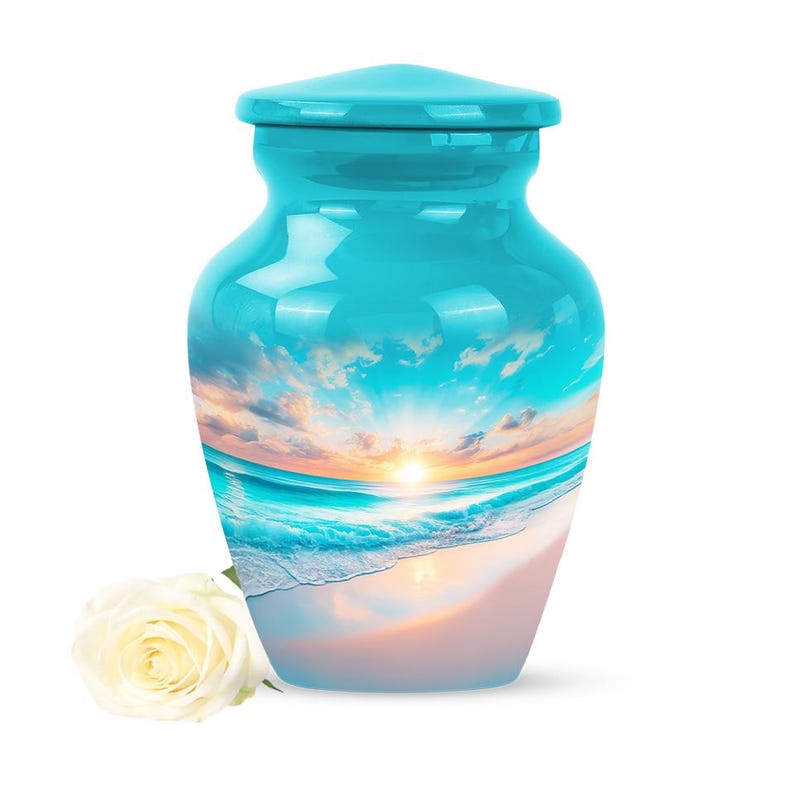 Small turquoise keepsake urn with peaceful beach and rising sun, 3-inch size