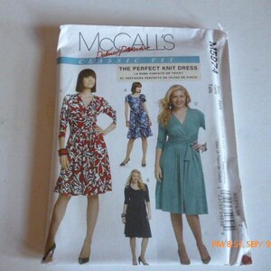 May include: McCall's Classic Fit sewing pattern for The Perfect Knit Dress. The pattern features illustrations of dresses in various styles and colors, including a red and white floral print wrap dress.