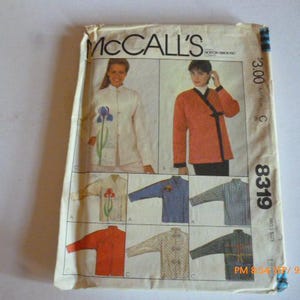 May include: A vintage McCall's sewing pattern featuring jacket designs. The pattern envelope displays images of the finished garments in various colors and styles, including a white jacket with floral embroidery and an orange jacket with black trim. The pattern number is 8319.
