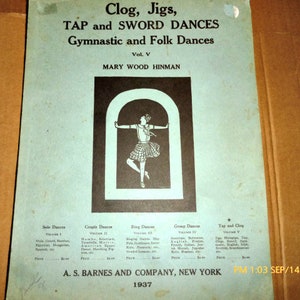 May include: A vintage book cover with the title "Clog, Jigs, TAP and SWORD DANCES Gymnastic and Folk Dances Vol. V MARY WOOD HINMAN". The cover features a black and white illustration of a woman in a skirt performing a dance move.