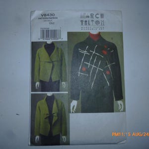 May include: A sewing pattern featuring a jacket design. The pattern includes illustrations of the jacket in different styles and colors, with the text "MARCH TILTON WEARABLE ART" and the pattern number "V8430".