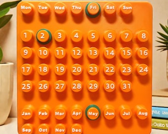 Vintage Ring-A-Date perpetual calendar in orange – Retro 1960s/70s design – Made in France