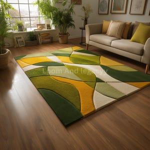 May include: A rectangular rug with a geometric design in shades of green, yellow, and white. The rug has a textured, abstract pattern, adding a modern touch to the room's decor. The rug is placed on a wooden floor.