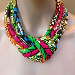 African Fashion fabric bib necklace, african wax golden metalic print with a central knot .