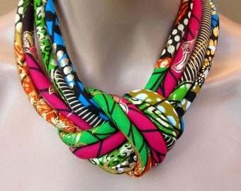African Fashion fabric bib necklace, african wax golden metalic print with a central knot .