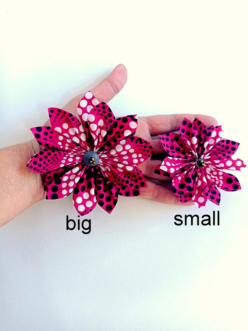 May include: Two fabric flowers with a pink and white polka dot pattern. The larger flower is labeled "big" and the smaller flower is labeled "small".