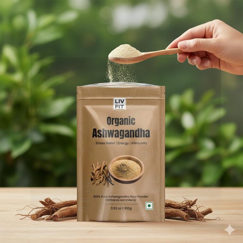 May include: A tan pouch of Organic Ashwagandha powder with the text "LIV FIT" and "Organic Ashwagandha". A wooden spoon dispenses the powder. The pouch also displays the text "Stress Relief | Energy | Immunity" and "100% Pure Ashwagandha Root Powder (Withania somnifera)".