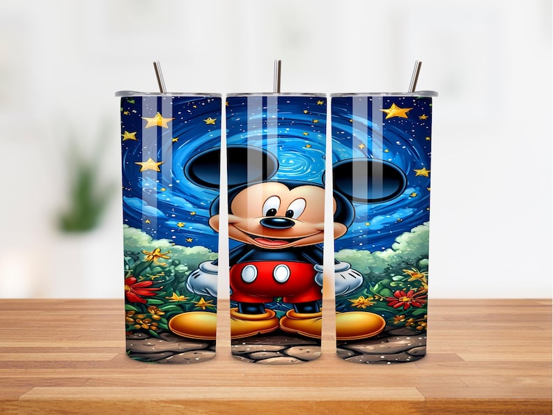 May include: A stainless steel tumbler featuring a cartoon image of Mickey Mouse. The design includes a night sky background with stars and flowers. The tumbler has a straw and is designed to hold approximately 20 ounces of liquid.
