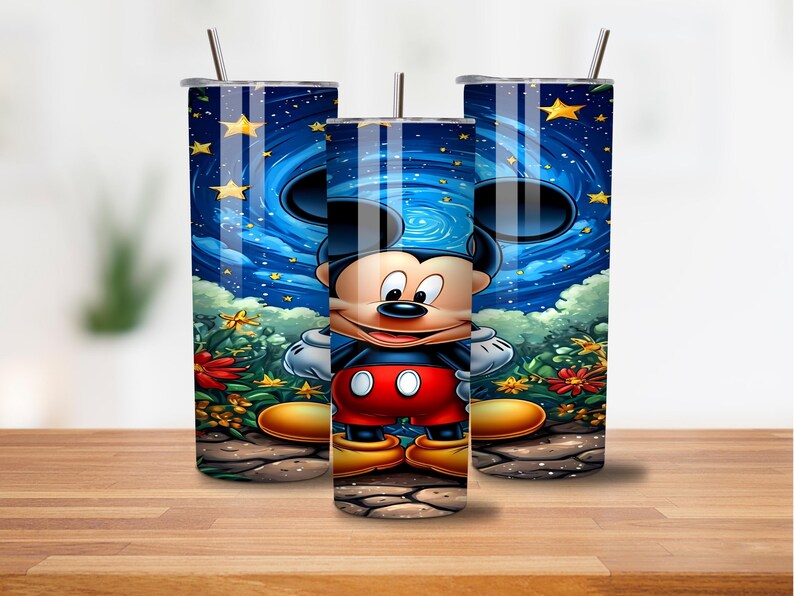 May include: Three tall, cylindrical tumblers with a Mickey Mouse design. The design features Mickey Mouse in front of a starry night sky with clouds and flowers. Each tumbler has a silver straw and a lid.