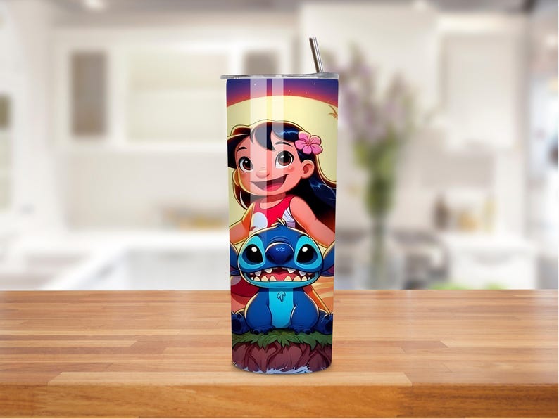 May include: A stainless steel tumbler featuring a colorful cartoon illustration of a girl and a blue alien-like creature. The design includes a pink flower and a sunset background. The tumbler has a silver lid and a straw.