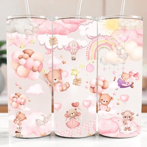 May include: Three stainless steel tumblers with a charming design. The tumblers showcase a pastel pink and beige backdrop adorned with teddy bears, clouds, balloons, and rainbows. Each tumbler is equipped with a clear straw.