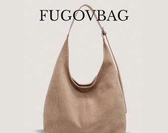 May include: A tan suede shoulder bag with a single strap and a curved design. The bag has a large capacity and a simple, elegant style. The text "FUGOVBAG" is printed at the top.