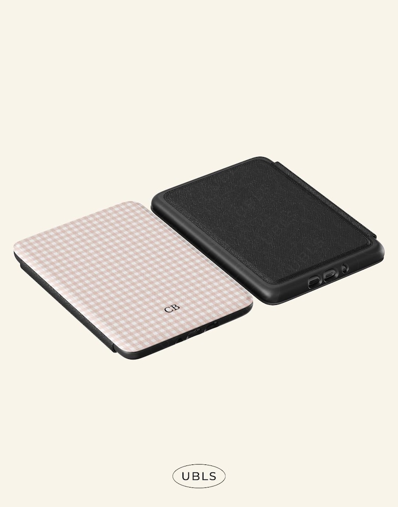 May include: Two phone cases. One case has a black textured surface. The other case has a pink and white gingham pattern with the initials "CB". The brand name "UBLS" is printed at the bottom.