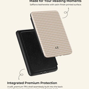 May include: A black and beige phone case featuring a gingham design and the initials "A.K." The case is made of Saffiano leatherette and has the text "Made for Your Reading Moments" and "Integrated Premium Protection."