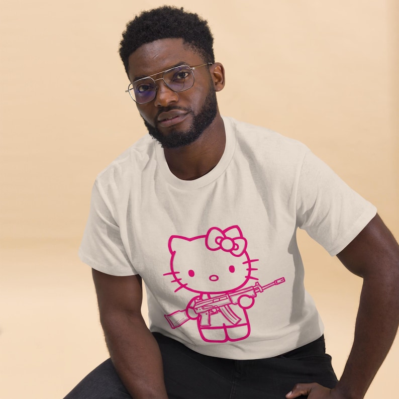 Pink Rebel Kitty Tee – Graffiti Style Hello Kitty with Gun | Kawaii Streetwear T-Shirt