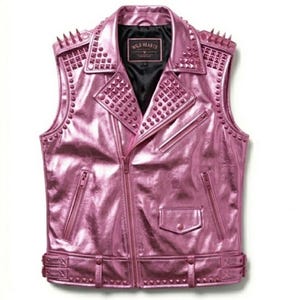 May include: A metallic pink vest with a studded design. The vest features a zip closure, multiple pockets, and decorative studs on the shoulders, collar, and waist. The vest has the text "WILD HEARTS" on the inner label.