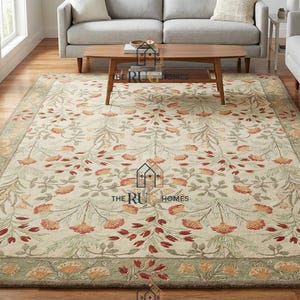 Op de afbeelding: Een set van drie keramische mokken met een gespikkelde, matte afwerking. De mokken zijn in crème, lichtgrijs en donkergrijs. Elke mok heeft een eenvoudig, minimalistisch ontwerp en een afgerond handvat.