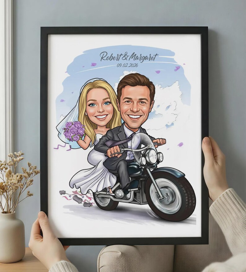 May include: A framed digital illustration of a couple on a motorcycle. The person on the back wears a white wedding dress and veil, holding a purple bouquet. The person in front wears a dark suit. Text reads Robert & Margaret 09.02.2026.