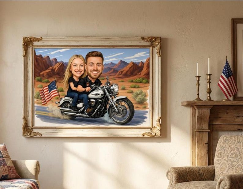 Framed artwork depicting a couple riding a motorcycle through a desert landscape. The artwork features a caricature style with the American flag waving in the background. The frame is ornate with gold accents.