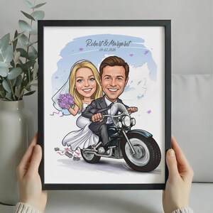 May include: A framed caricature illustration of a bride and groom riding a motorcycle. The bride wears a white dress and veil, holding purple flowers. The groom wears a dark suit. Text reads Robert & Margaret and 09.02.2026.