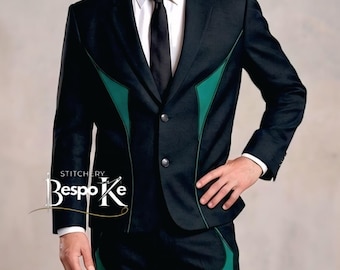 May include: A black suit with green detailing, a white shirt, and a black tie. The suit has a distinctive design with green trim on the lapels and down the trouser sides. The text "Stitchery Bespoke" is visible on the left side of the suit.