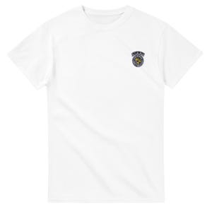 May include: A white t-shirt with a small, circular emblem on the upper left chest. The emblem features a gold-colored design within a silver-colored border, with the word "SAAR" above it.