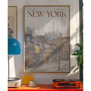 May include: A framed vintage poster of New York City, dated March 2, 1968, depicting a winter scene of brownstone buildings and a distant cityscape. The poster is in a gold frame and has the words "NEW YORK" in red.
