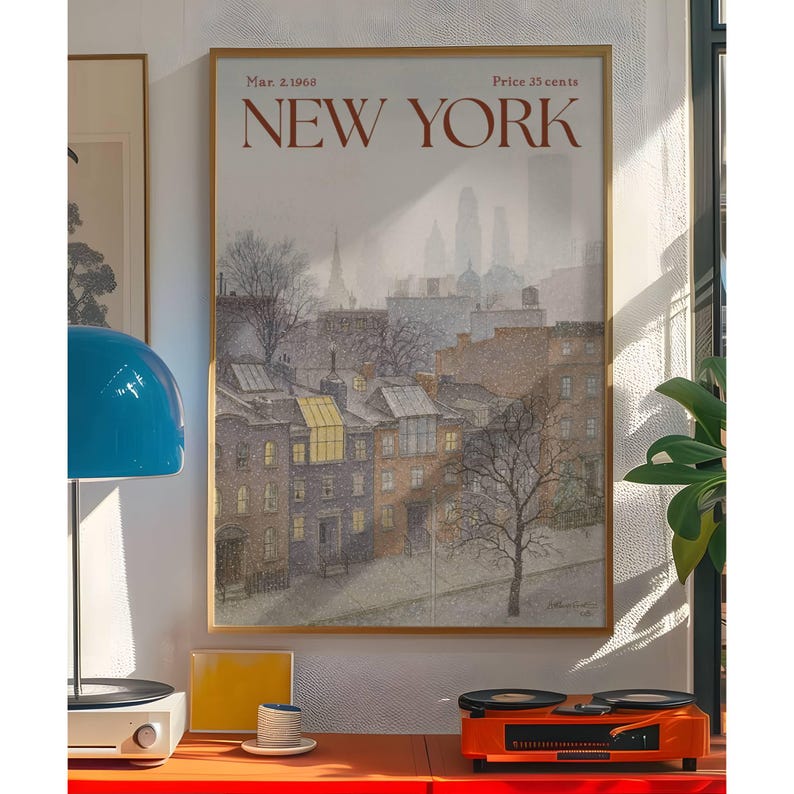May include: A framed vintage poster of New York City, dated March 2, 1968, depicting a winter scene of brownstone buildings and a distant cityscape. The poster is in a gold frame and has the words "NEW YORK" in red.