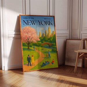 May include: A framed vintage New York City poster. The poster features a park scene with a bridge, a large tree with pink blossoms, and the New York skyline. The text "April 25, 1994" and "Price $1.5" are visible.