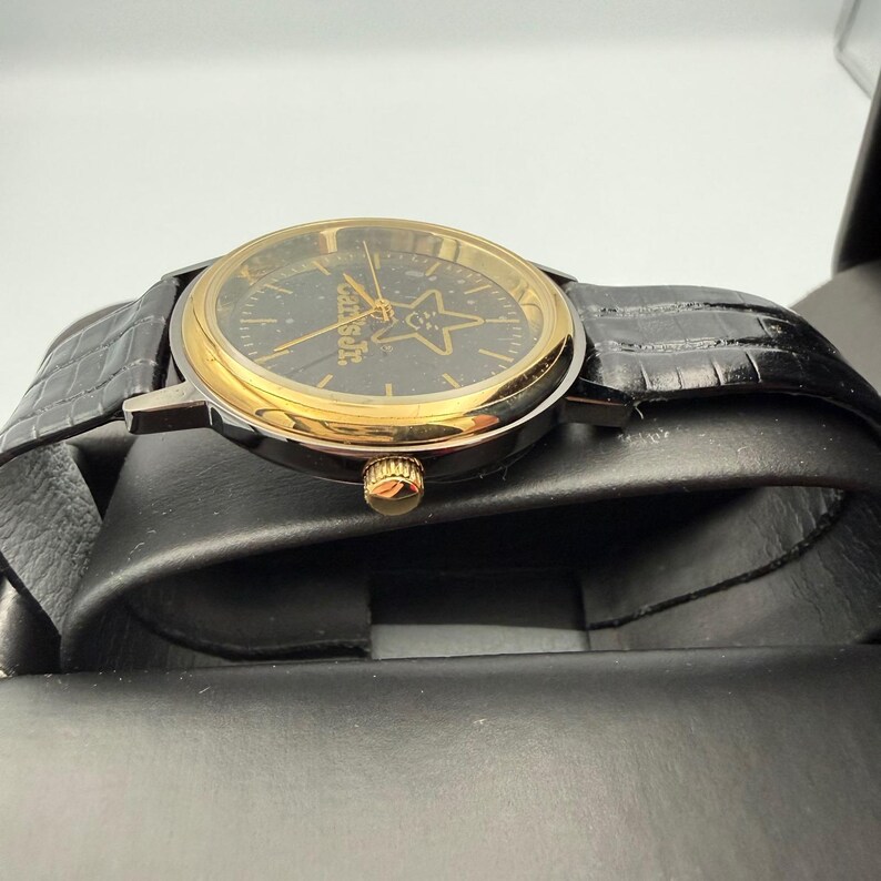 Carls Jr Armbanduhr Gold-Ton Schwarz Lederarmband Stern-Logo Analog Quarz Time Corp Bild 8